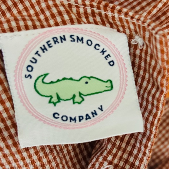 Southern Smocked orange and white gingham checked cheer romper. - Picture 4 of 5